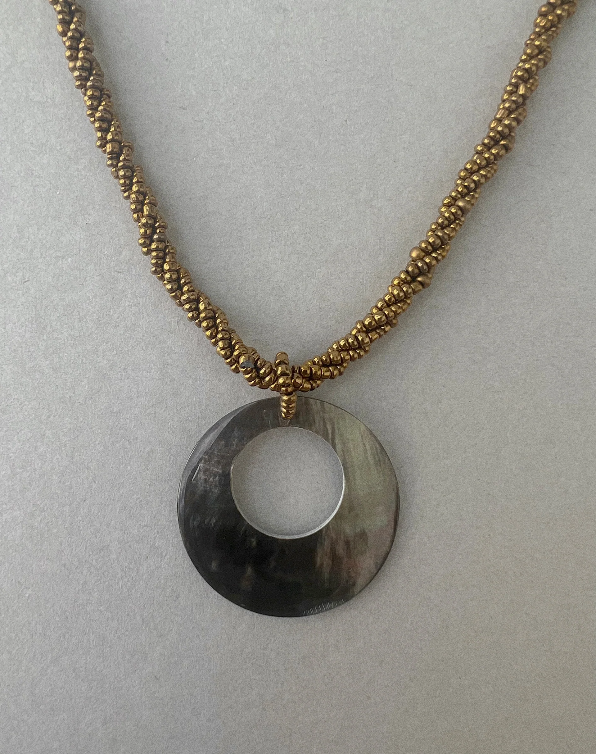Arma Necklace with Round Shell Pendant in Gold - Image 2